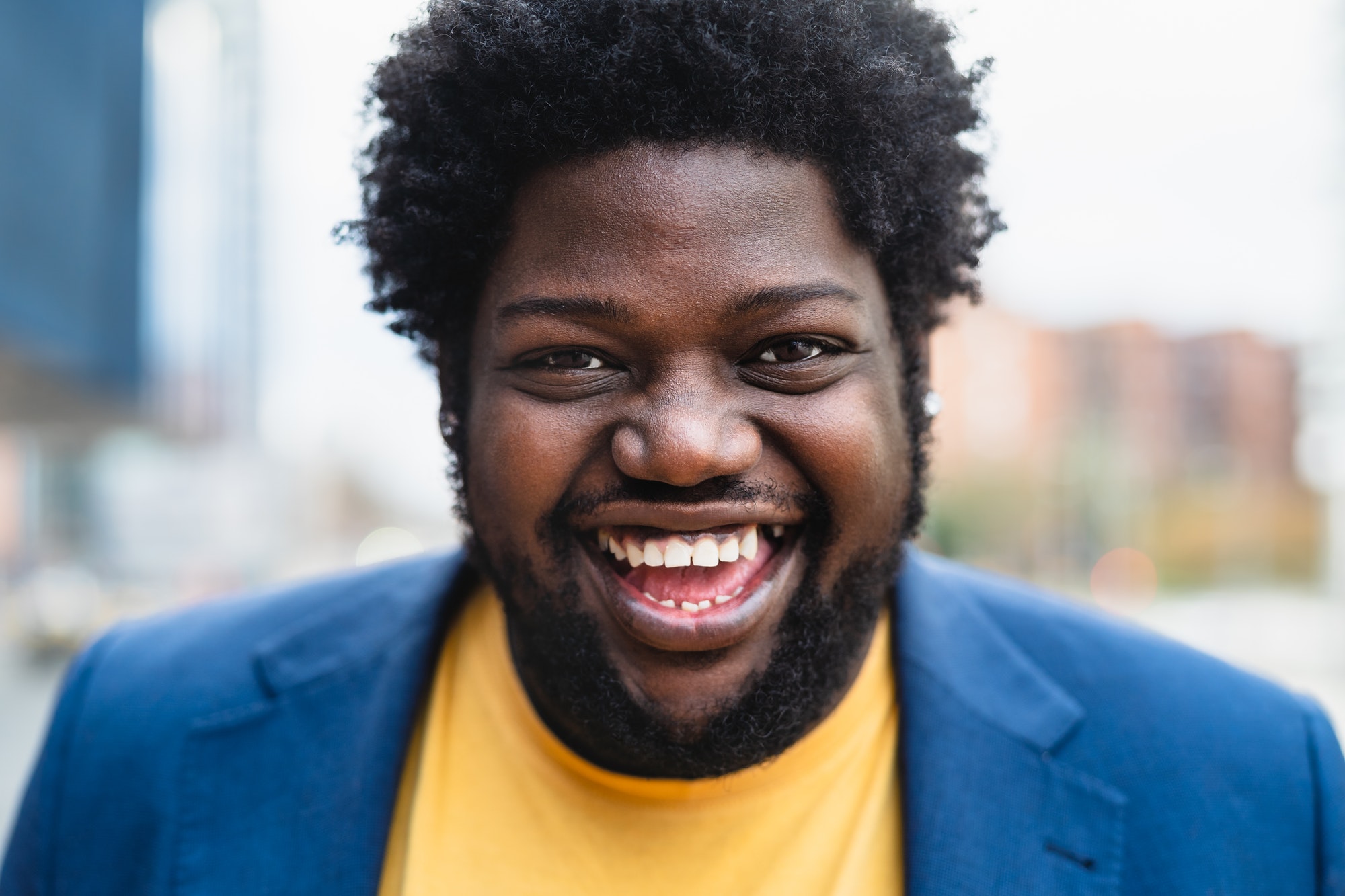 Happy African man smiling front of camera outdoor