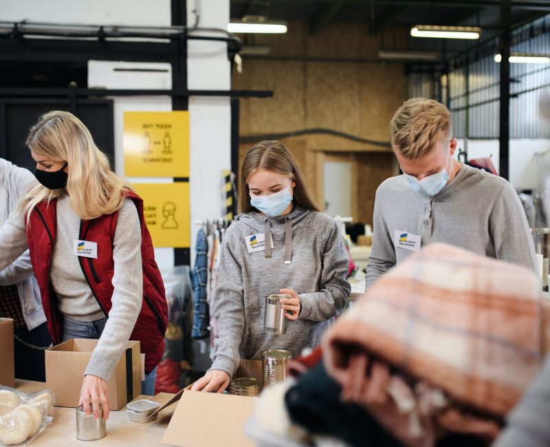 volunteers-sorting-out-donated-food-and-clothes-for-the-needs-of-ukrainian-migrants-humanitarian.jpg